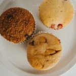 MUFFINS (CRANBERRY ORANGE,<br> CARAMEL COFFEE, <br>GOLDEN RAISIN BARN)