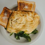 BRIE & SPINACH OMLETTE WITH HASHBROWN & TOAST